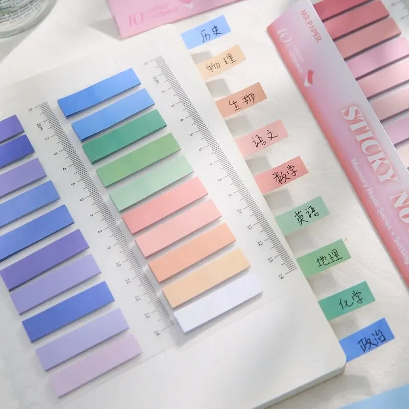 Bentopop colorful sticky notes with labels next to a ruler on a white surface