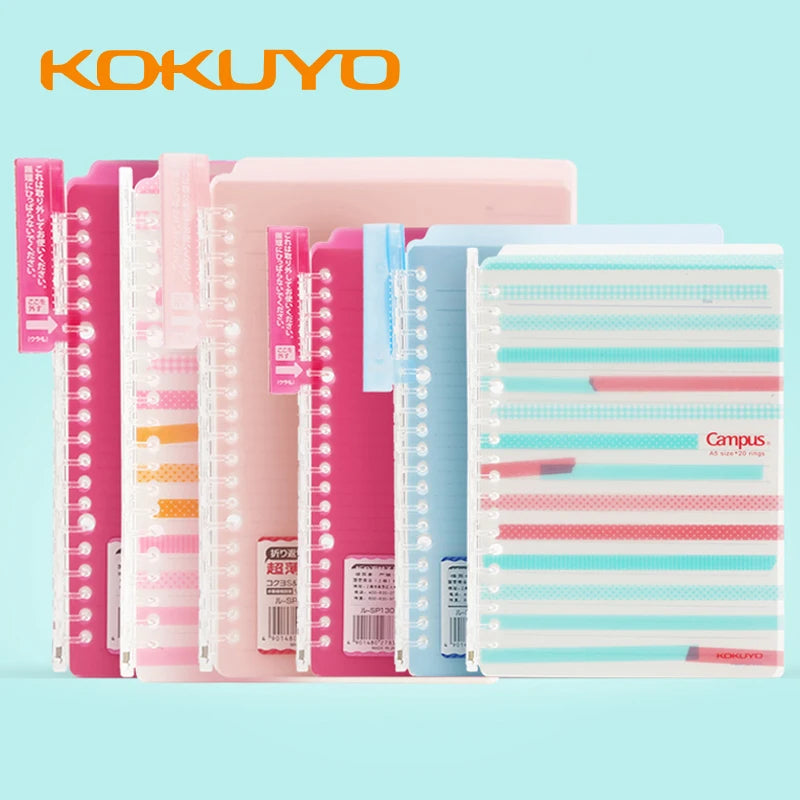 Kokuyo notebooks with colorful covers on a light blue background