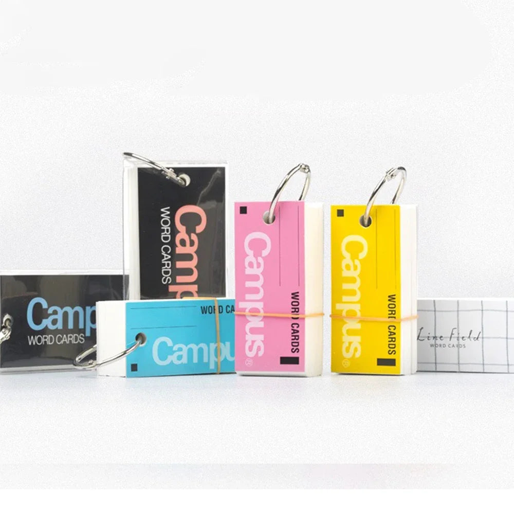 Colorful 'Campus' word card books with carabiners on a white background