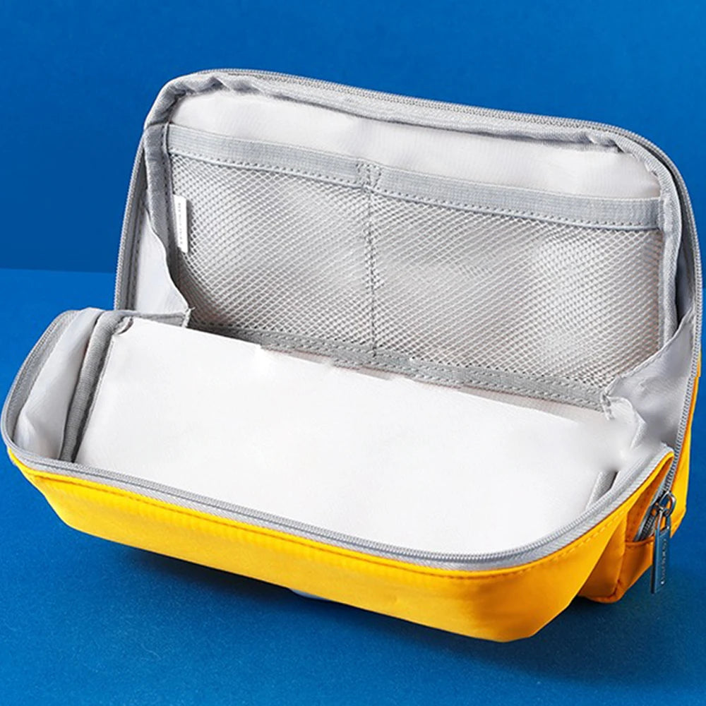 Yellow and gray travel pouch on a blue background