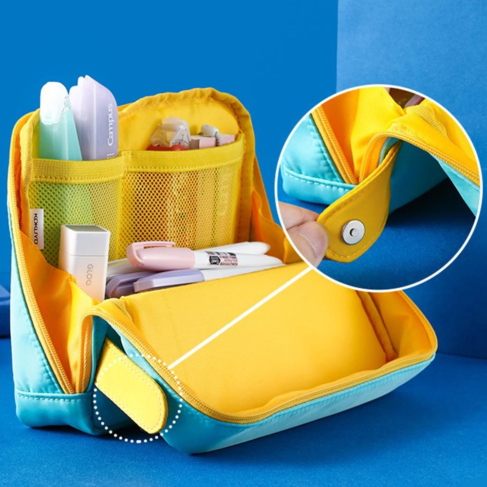 Yellow and blue toiletry bag with compartments on a blue background