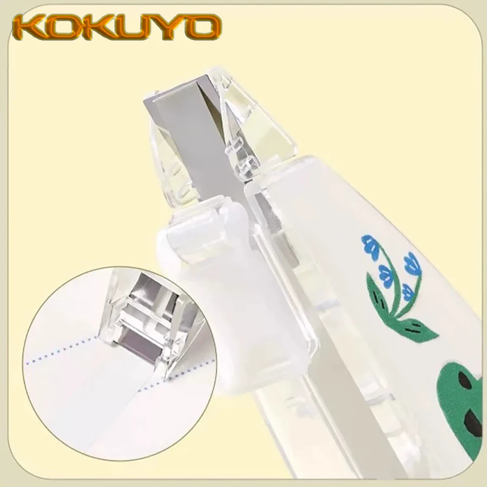 Kokuyo hole puncher with close-up detail on a beige background