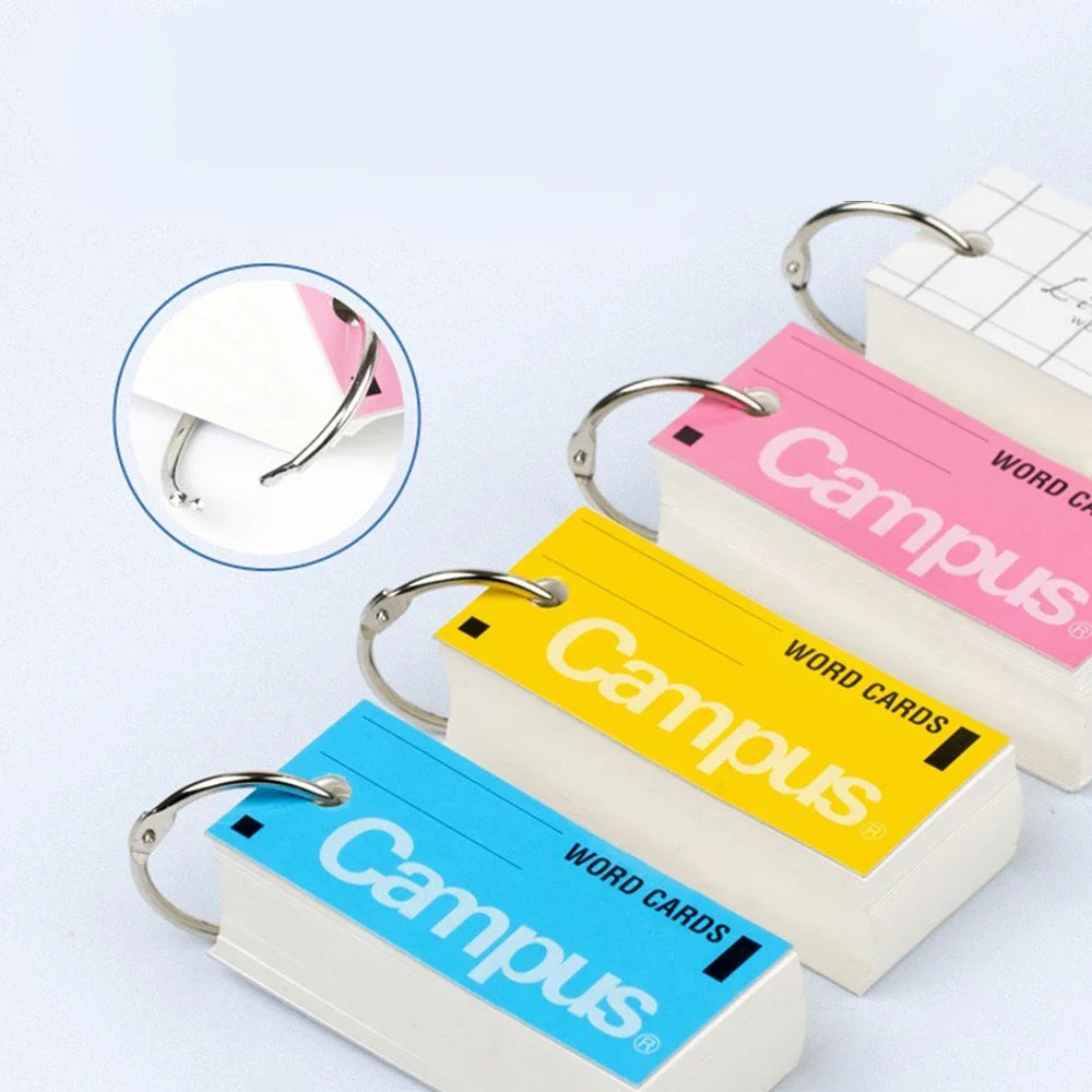 Colorful 'Campus' word card books with a close-up of the ring on a light blue background.