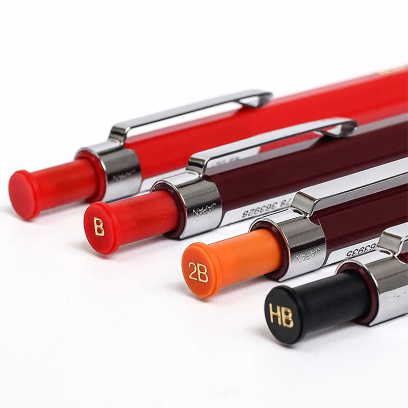 Set of mechanical pencils with red, orange, and black leads on a white background