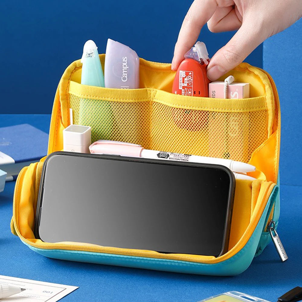 Yellow and blue travel organizer with various items on a blue background
