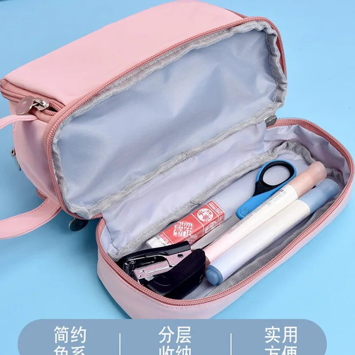 Bentopop pink pencil case with KPOP Demon Hunters characters on a blue background