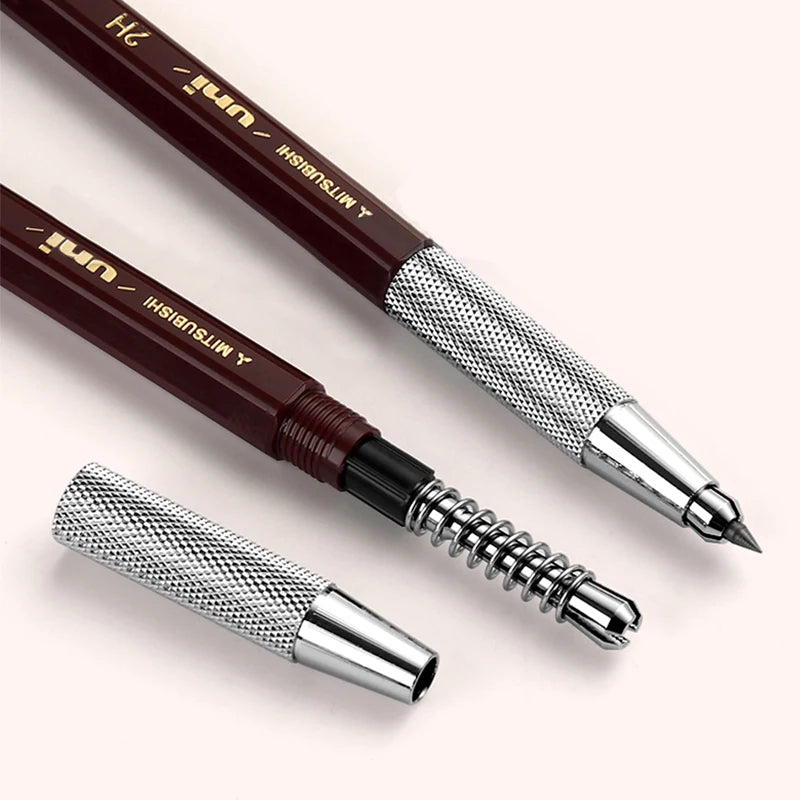 Two pens with metallic caps and a white background