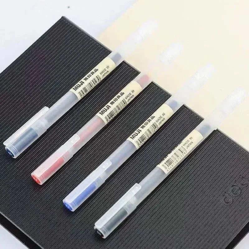 Set of three markers with visible brand labels on a textured surface