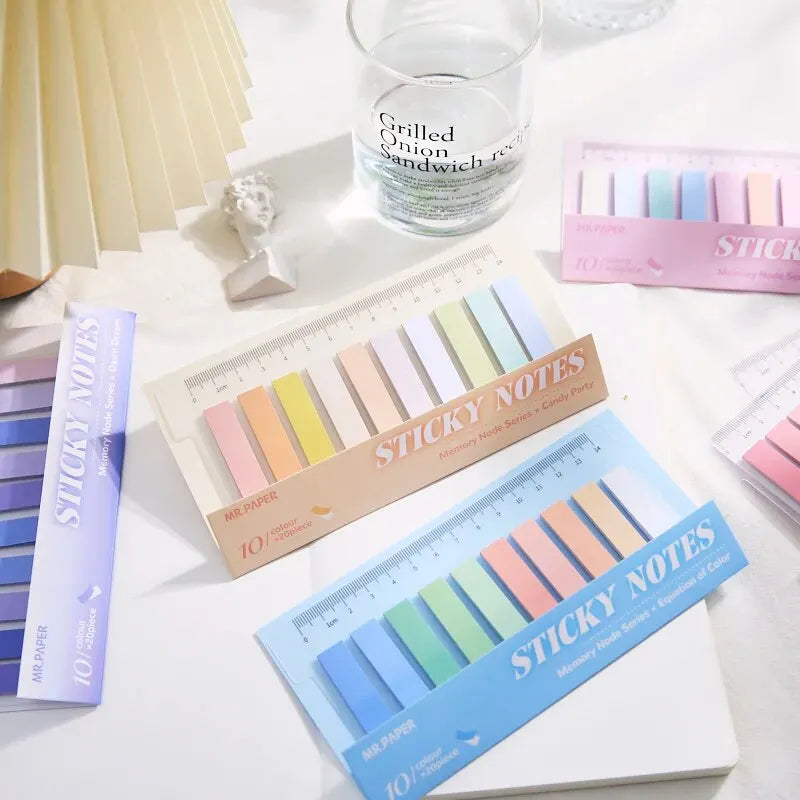 Bentopop  pastel-colored sticky notes with a ruler on a white surface.
