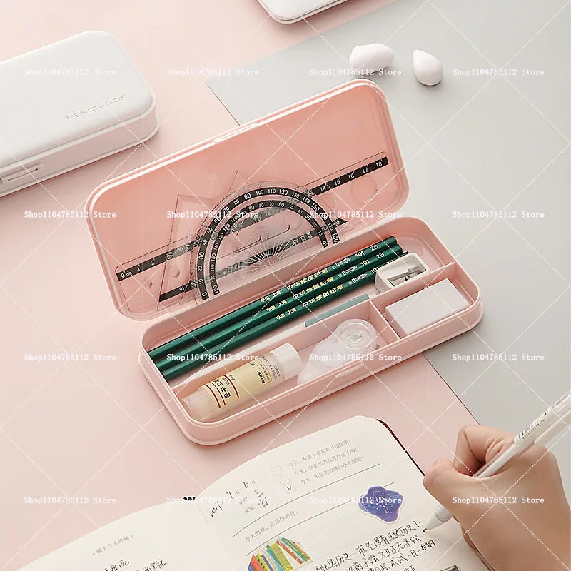 Bentopop pink pencil case with stationery items on a pink surface
